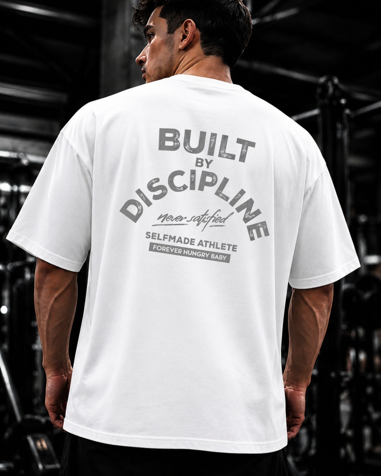 Polo Oversize Gym con frase “BUILT BY DISCIPLINE”