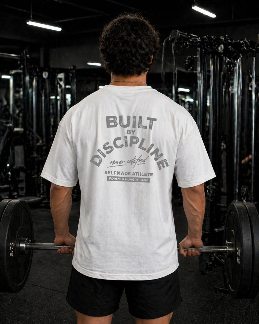 Polo Oversize Gym con frase “BUILT BY DISCIPLINE”
