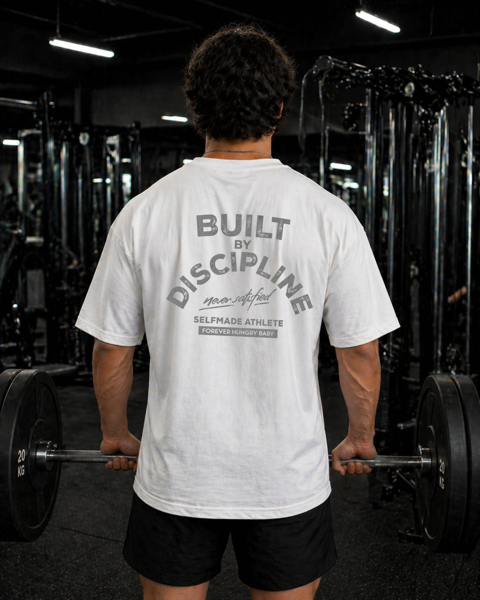 Polo Oversize Gym con frase “BUILT BY DISCIPLINE”