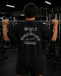 Polo Oversize Gym con frase “BUILT BY DISCIPLINE”