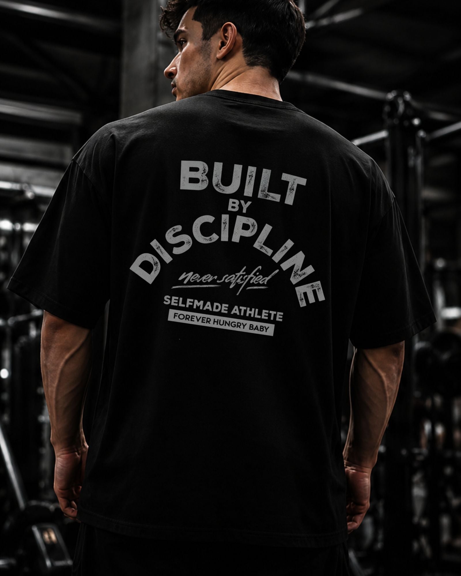 Polo Oversize Gym con frase “BUILT BY DISCIPLINE”