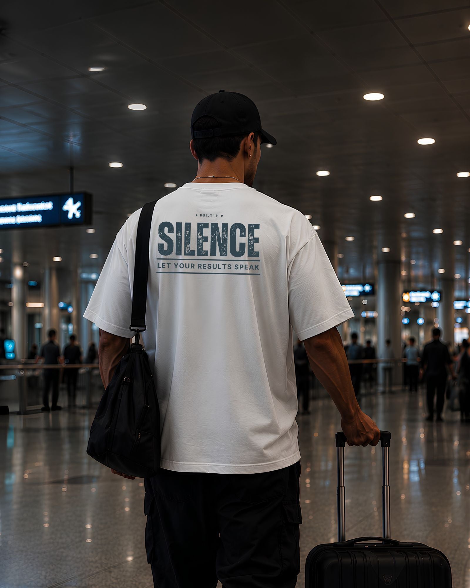 Polo oversize gym con frase "SILENCE | RESULTS SPEAK"