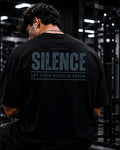 Polo oversize gym con frase "SILENCE | RESULTS SPEAK"