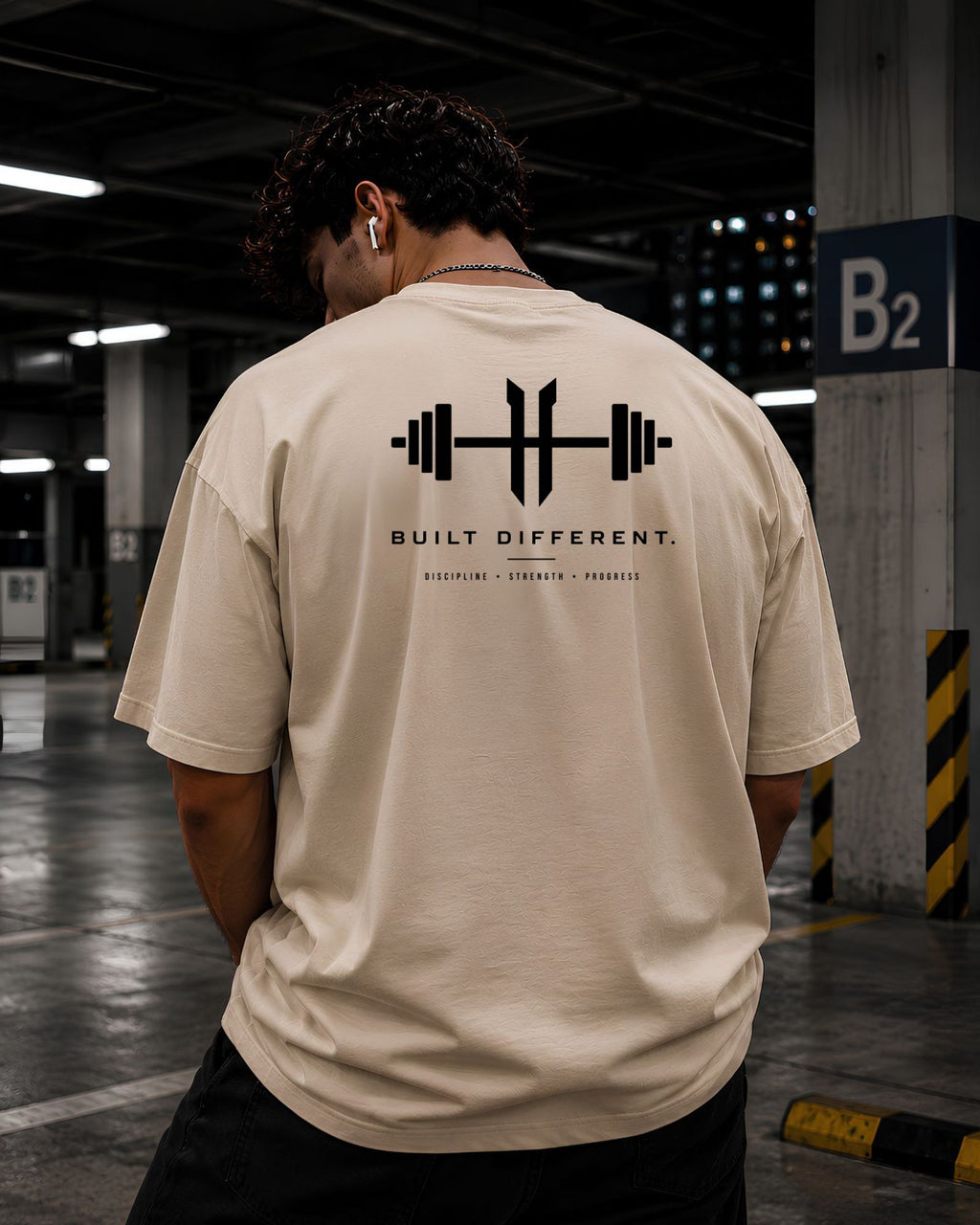 polo oversize para gym color beige espalda